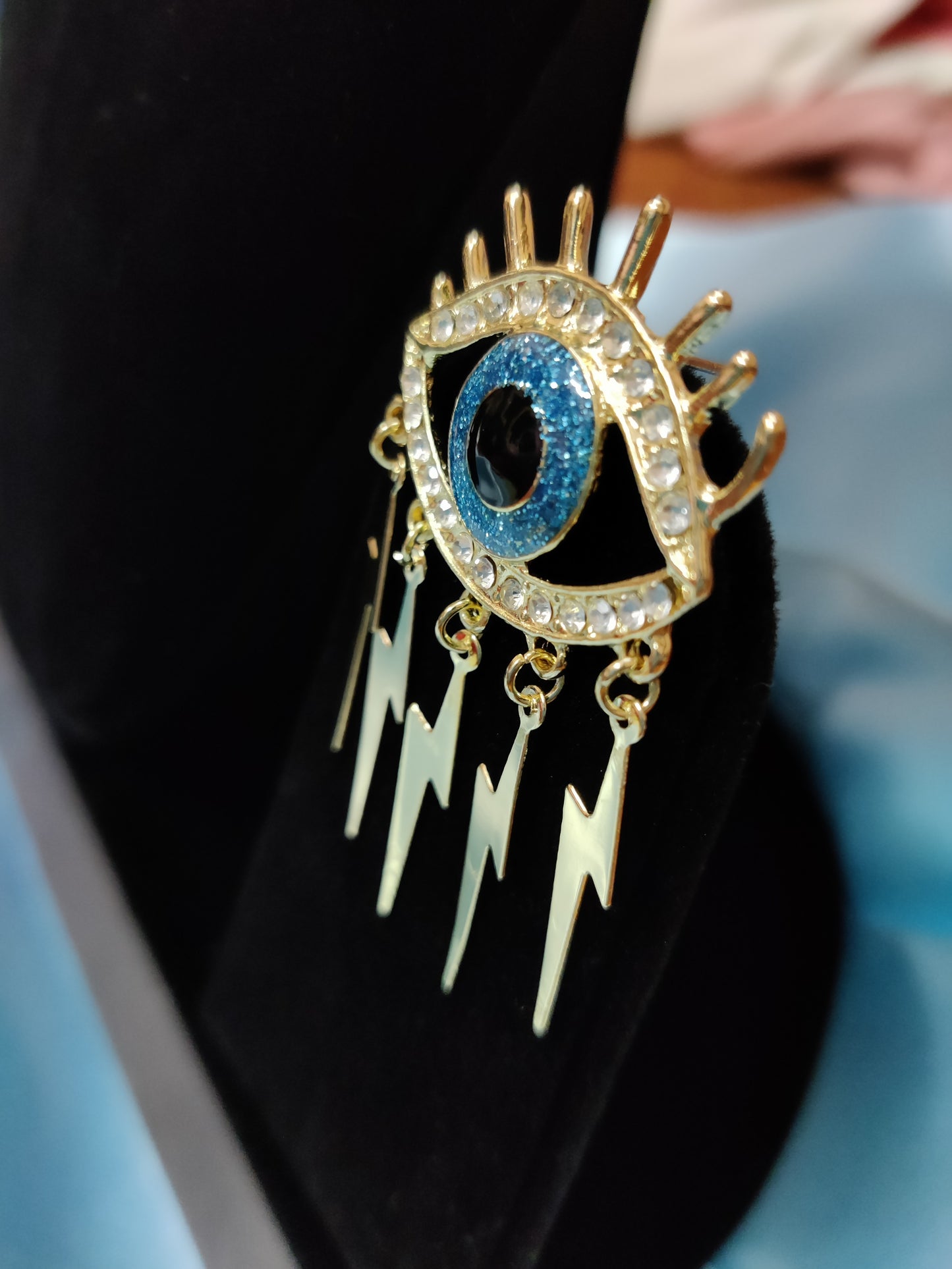 evil eye with current designed earring